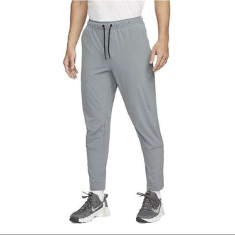 NIKE AS M NK DF UNLIMITED PANT TPR FB7549-084 PANT TRAINING (M)